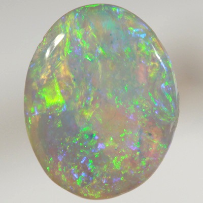 SOLID CRYSTAL OPAL Bright sparkles of greens throughout a purple hue
